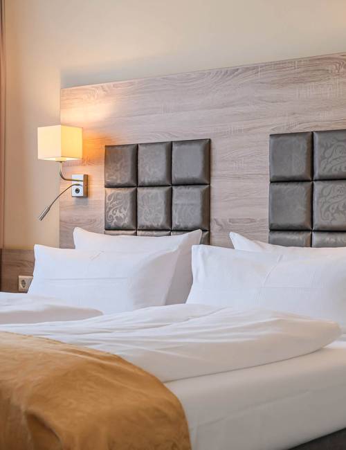 Doppelbett eines Studios im Suite Hotel Leipzig